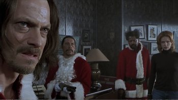 Movie still from “Reindeer Games” (2000), directed by John Frankenheimer – A group of men dressed in santa suits and holding guns; Close Up shot, Over the shoulder angle