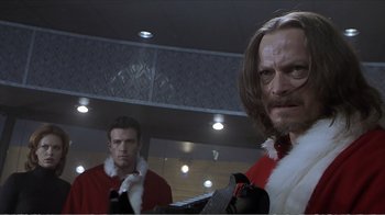 Movie still from “Reindeer Games” (2000), directed by John Frankenheimer – Two men in santa suits are standing in a room; Close Up shot, Low angle