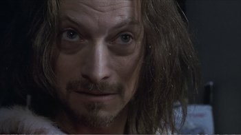 Movie still from “Reindeer Games” (2000), directed by John Frankenheimer – A person with long brown hair; Close Up shot, Over the shoulder angle