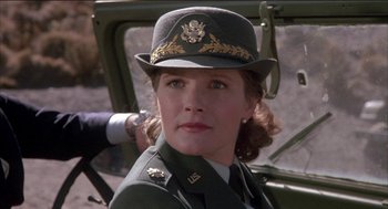 Movie still from “Remo Williams: The Adventure Begins” (1985), directed by Guy Hamilton – A person wearing a hat; Close Up shot, Low angle