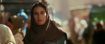 Movie still from “Rendition” (2007), directed by Gavin Hood – A woman wearing a head scarf is looking into the camera; Close Up shot, Over the shoulder angle