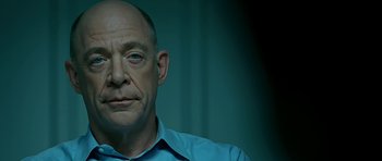 Movie still from “Rendition” (2007), directed by Gavin Hood – An older man wearing a blue dress shirt; Close Up shot, Over the shoulder angle