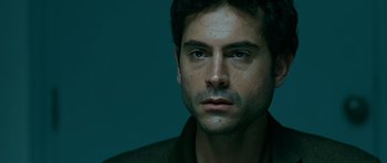 Movie still from “Rendition” (2007), directed by Gavin Hood – A person wearing a jacket; Close Up shot, High angle