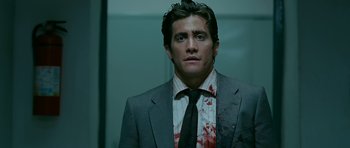 Movie still from “Rendition” (2007), directed by Gavin Hood – A person wearing a suit and tie; Close Up shot, Low angle