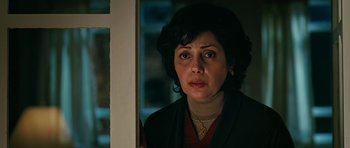 Movie still from “Rendition” (2007), directed by Gavin Hood – A person looking at the camera; Close Up shot, High angle