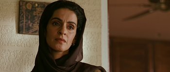 Movie still from “Rendition” (2007), directed by Gavin Hood – A person wearing a headscarf; Close Up shot, Low angle