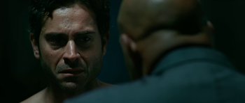 Movie still from “Rendition” (2007), directed by Gavin Hood – A person in a mirror; Close Up shot, Over the shoulder angle