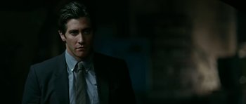 Movie still from “Rendition” (2007), directed by Gavin Hood – A person wearing a suit and tie; Close Up shot, Low angle