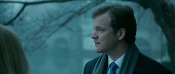 Movie still from “Rendition” (2007), directed by Gavin Hood – A person wearing a suit and tie; Close Up shot, Low angle