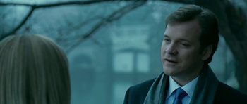 Movie still from “Rendition” (2007), directed by Gavin Hood – A person wearing a suit and tie; Close Up shot, Over the shoulder angle