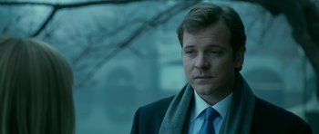 Movie still from “Rendition” (2007), directed by Gavin Hood – A person wearing a suit and tie; Close Up shot, Over the shoulder angle