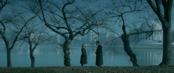 Movie still from “Rendition” (2007), directed by Gavin Hood – Two people standing next to a body of water; Wide shot, High angle