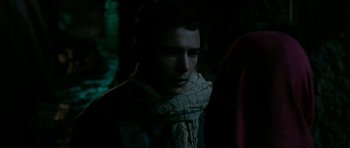 Movie still from “Rendition” (2007), directed by Gavin Hood – A man wearing a scarf in the dark; Close Up shot, Over the shoulder angle