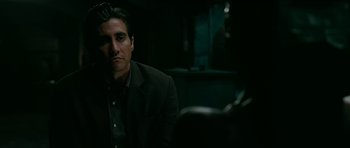 Movie still from “Rendition” (2007), directed by Gavin Hood – A person wearing a suit and tie; Close Up shot, Over the shoulder angle