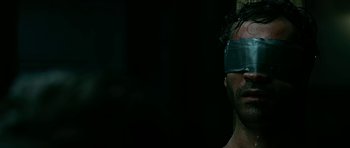 Movie still from “Rendition” (2007), directed by Gavin Hood – A person with a blindfold on; Close Up shot, Over the shoulder angle
