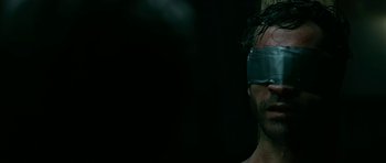 Movie still from “Rendition” (2007), directed by Gavin Hood – A man with a blindfold on his head; Close Up shot, Over the shoulder angle