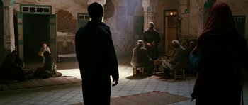 Movie still from “Rendition” (2007), directed by Gavin Hood – A group of men sitting in a room; Wide shot, Over the shoulder angle