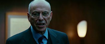 Movie still from “Rendition” (2007), directed by Gavin Hood – An older man wearing a suit and tie; Close Up shot, Over the shoulder angle
