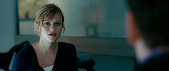 Movie still from “Rendition” (2007), directed by Gavin Hood – A beautiful young woman sitting in a chair; Close Up shot, Over the shoulder angle