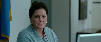 Movie still from “Rendition” (2007), directed by Gavin Hood – An older woman is looking at the camera; Close Up shot, Over the shoulder angle