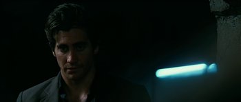 Movie still from “Rendition” (2007), directed by Gavin Hood – A person wearing a black shirt; Close Up shot, Over the shoulder angle