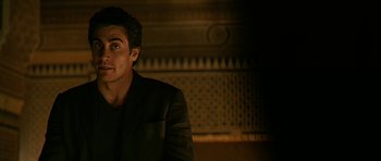 Movie still from “Rendition” (2007), directed by Gavin Hood – A person wearing a jacket; Close Up shot, Over the shoulder angle