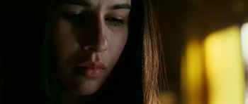 Movie still from “Rendition” (2007), directed by Gavin Hood – A woman's face with tears coming out of her eyes; Close Up shot, Low angle