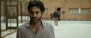 Movie still from “Rendition” (2007), directed by Gavin Hood – A person wearing a shirt; Close Up shot, Over the shoulder angle