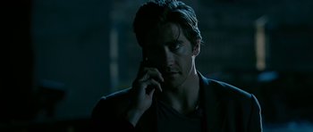 Movie still from “Rendition” (2007), directed by Gavin Hood – A person talking on a cell phone; Close Up shot, Low angle