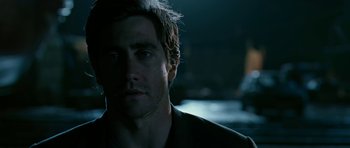 Movie still from “Rendition” (2007), directed by Gavin Hood – A person wearing a black shirt; Close Up shot, Over the shoulder angle