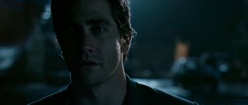 Movie still from “Rendition” (2007), directed by Gavin Hood – Close up of a man's face in a dark room; Close Up shot, Over the shoulder angle