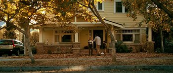 Movie still from “Rendition” (2007), directed by Gavin Hood – A man and a woman holding hands in front of a house; Wide shot, Over the shoulder angle