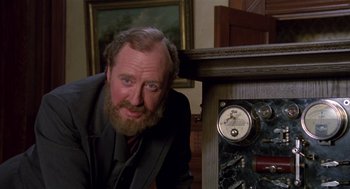 Movie still from “Return to Oz” (1985), directed by Walter Murch – A man with a long beard leaning against a wall; Close Up shot, Low angle