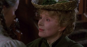 Movie still from “Return to Oz” (1985), directed by Walter Murch – An older woman wearing a straw hat and a green dress; Close Up shot, Low angle