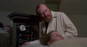 Movie still from “Return to Oz” (1985), directed by Walter Murch – An older man standing next to a little girl; Medium shot, Low angle