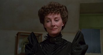 Movie still from “Return to Oz” (1985), directed by Walter Murch – An older woman wearing a black dress and a black necklace; Close Up shot, Low angle