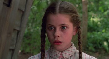 Movie still from “Return to Oz” (1985), directed by Walter Murch – A young girl with pigtails stares into the camera; Close Up shot, Low angle