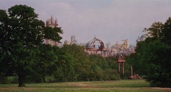 Movie still from “Return to Oz” (1985), directed by Walter Murch – An image of a park in the middle of a city; Extreme Wide shot, Low angle