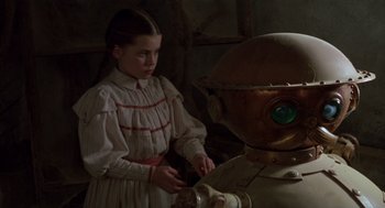 Movie still from “Return to Oz” (1985), directed by Walter Murch – A young girl is looking at an old robot; Close Up shot, High angle