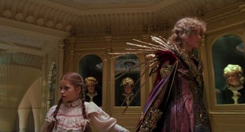 Movie still from “Return to Oz” (1985), directed by Walter Murch – A woman and a girl dressed in costumes; Medium shot, Low angle