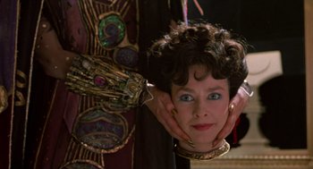 Movie still from “Return to Oz” (1985), directed by Walter Murch – A person with their hands on their face; Close Up shot, Over the shoulder angle