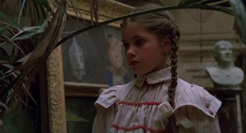 Movie still from “Return to Oz” (1985), directed by Walter Murch – A young girl in a striped dress with long braids; Close Up shot, Low angle