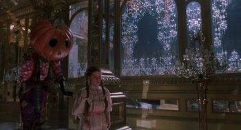 Movie still from “Return to Oz” (1985), directed by Walter Murch – A young girl standing in front of a window; Wide shot, High angle