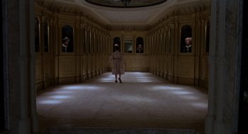 Movie still from “Return to Oz” (1985), directed by Walter Murch – A woman is walking down a hall way; Extreme Wide shot, High angle
