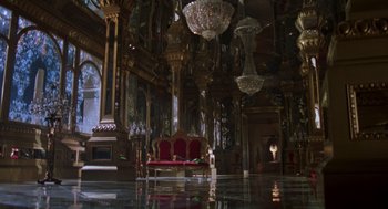Movie still from “Return to Oz” (1985), directed by Walter Murch – A room filled with chandeliers and a red couch; Extreme Wide shot, High angle