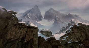 Movie still from “Return to Oz” (1985), directed by Walter Murch – A painting of a mountain range with snow on it's tops; Extreme Wide shot, High angle