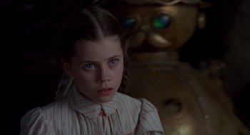 Movie still from “Return to Oz” (1985), directed by Walter Murch – A young girl in a striped shirt looking at the camera; Close Up shot, Over the shoulder angle