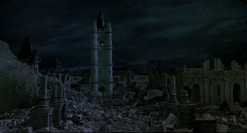 Movie still from “Return to Oz” (1985), directed by Walter Murch – An old clock tower in the middle of the ruins; Extreme Wide shot, High angle