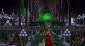 Movie still from “Return to Oz” (1985), directed by Walter Murch – Two people walking down a hall way with a large clock; Wide shot, High angle
