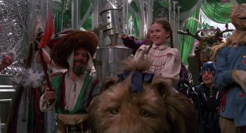 Movie still from “Return to Oz” (1985), directed by Walter Murch – Two people dressed in costumes with a lion's head in front of them; Medium shot, Low angle